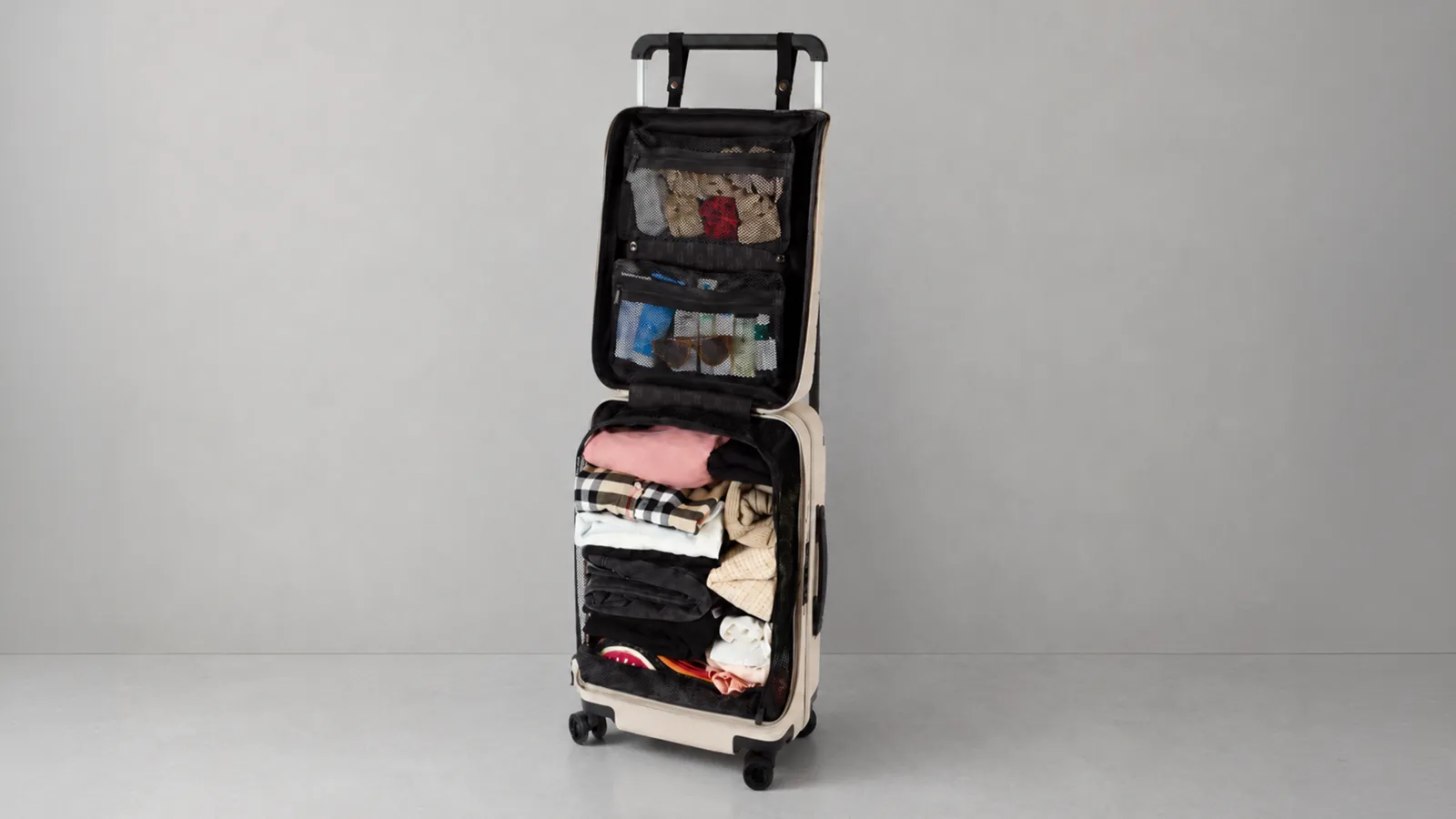 The case standing open like a wardrobe, packed shelves visible.